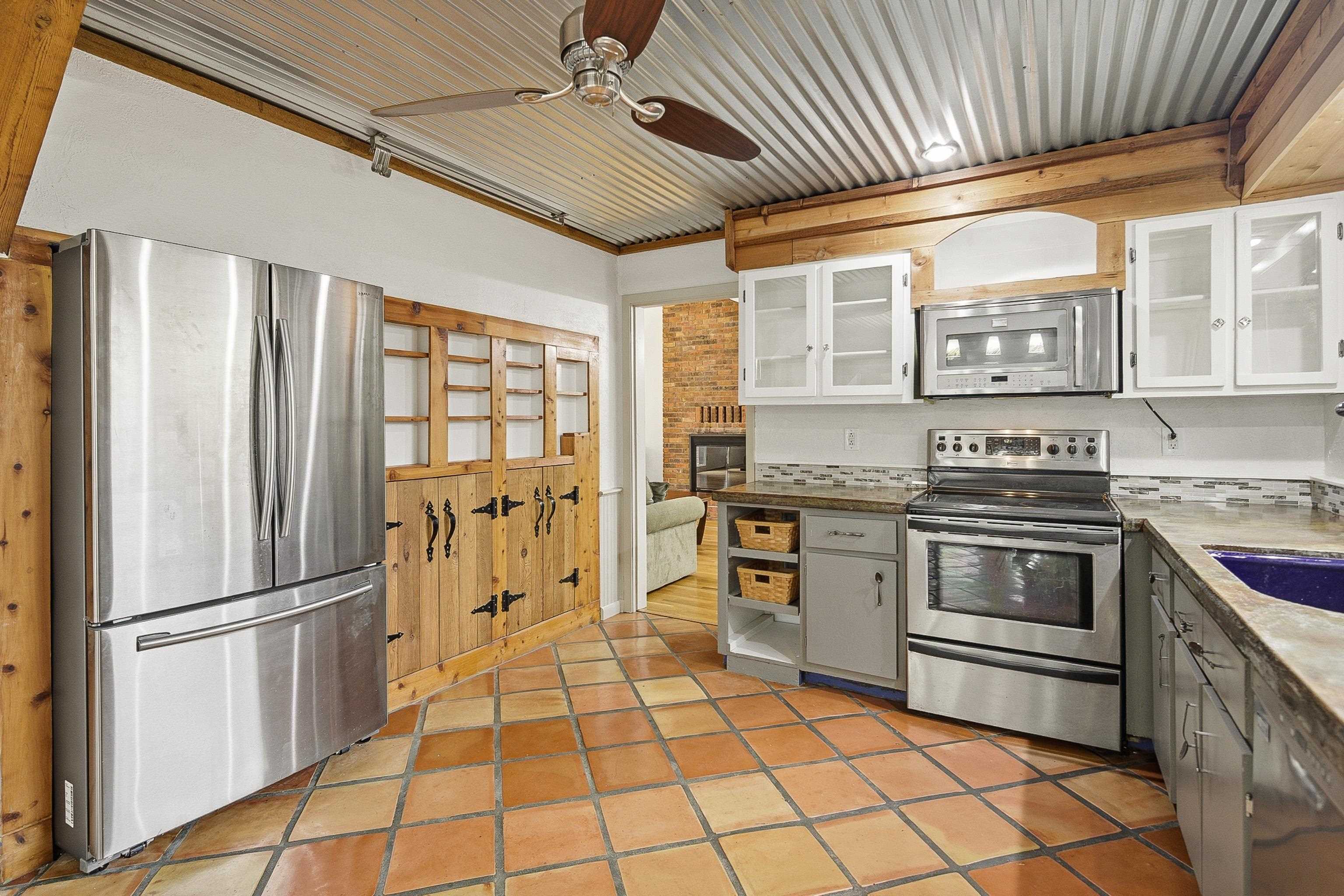 1833 New Riverdale Road Germantown, TN 38138 - Photo 13 of 40 a kitchen with stainless steel appliances granite countertop a refrigerator and a stove