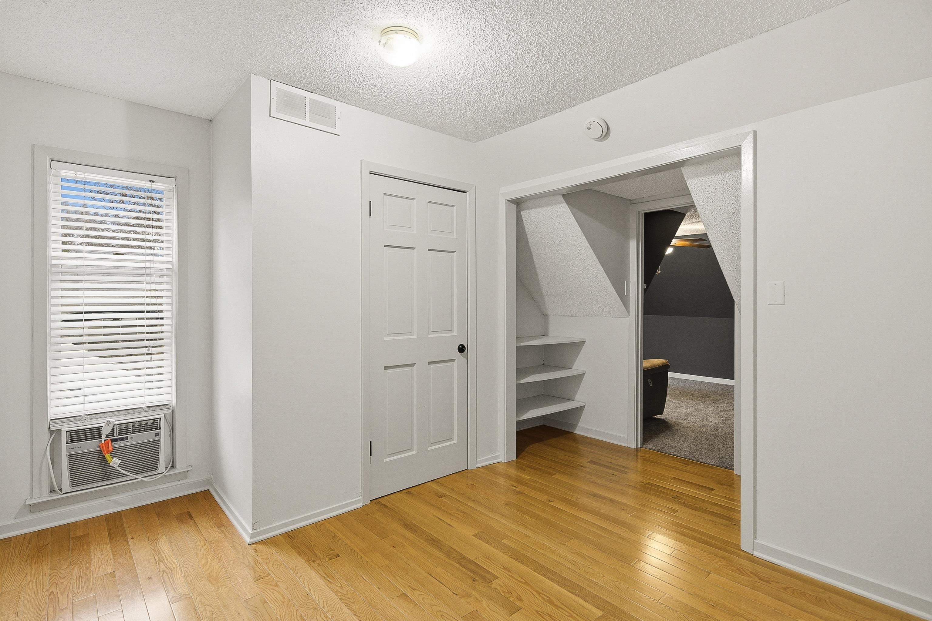 1833 New Riverdale Road Germantown, TN 38138 - Photo 25 of 40 a view of empty room with wooden floor and fan
