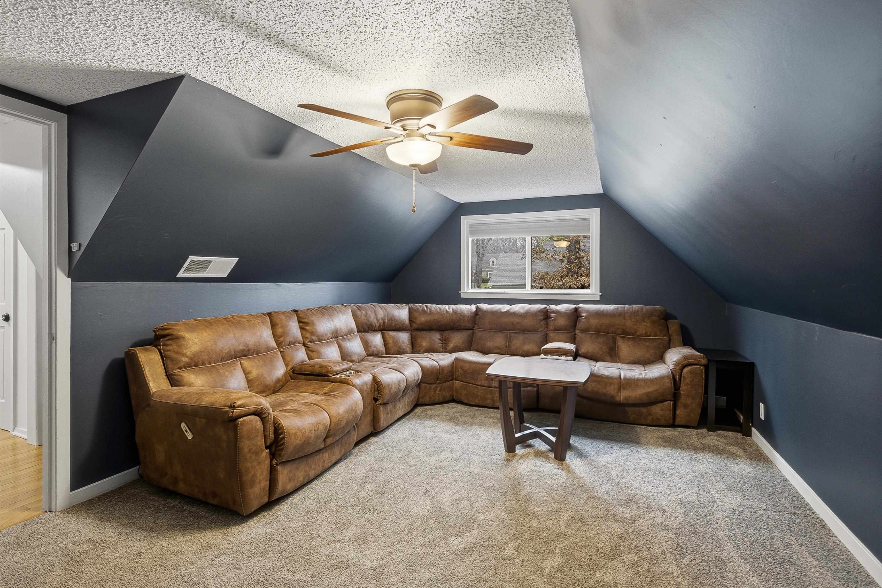 1833 New Riverdale Road Germantown, TN 38138 - Photo 26 of 40 a living room with furniture and a ceiling fan