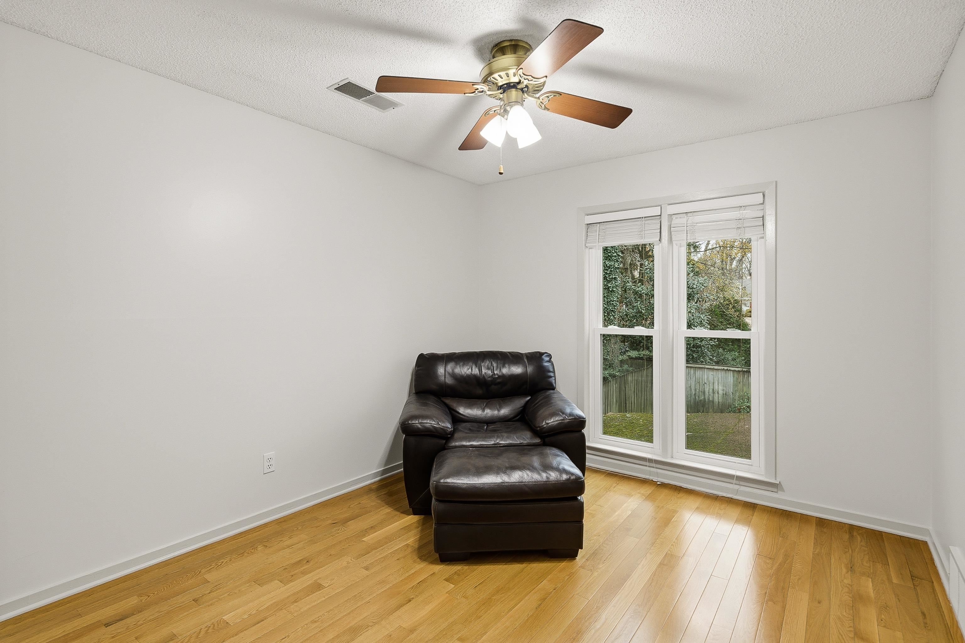 1833 New Riverdale Road Germantown, TN 38138 - Photo 28 of 40 a room with hard wood floor and window