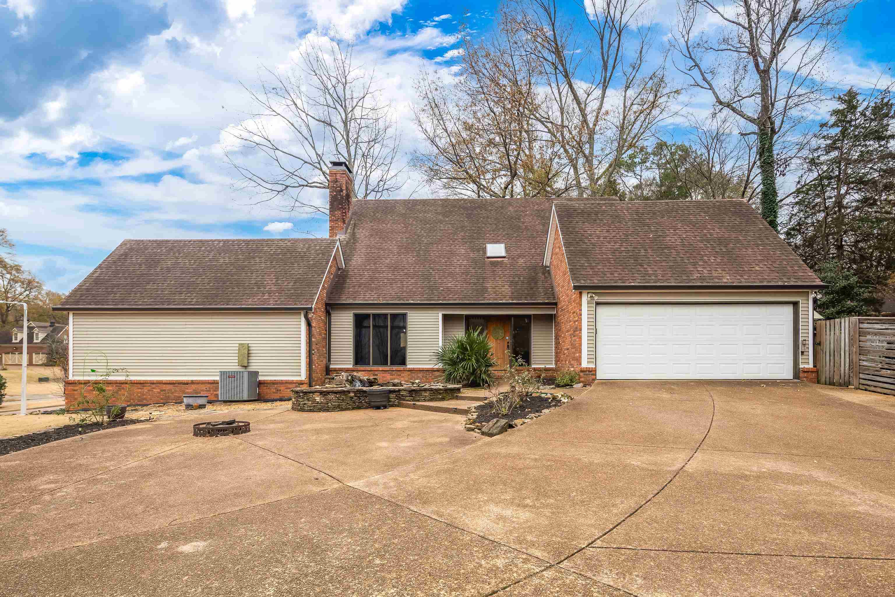 1833 New Riverdale Road Germantown, TN 38138 - Photo 40 of 40 a view of a house with a yard and large trees