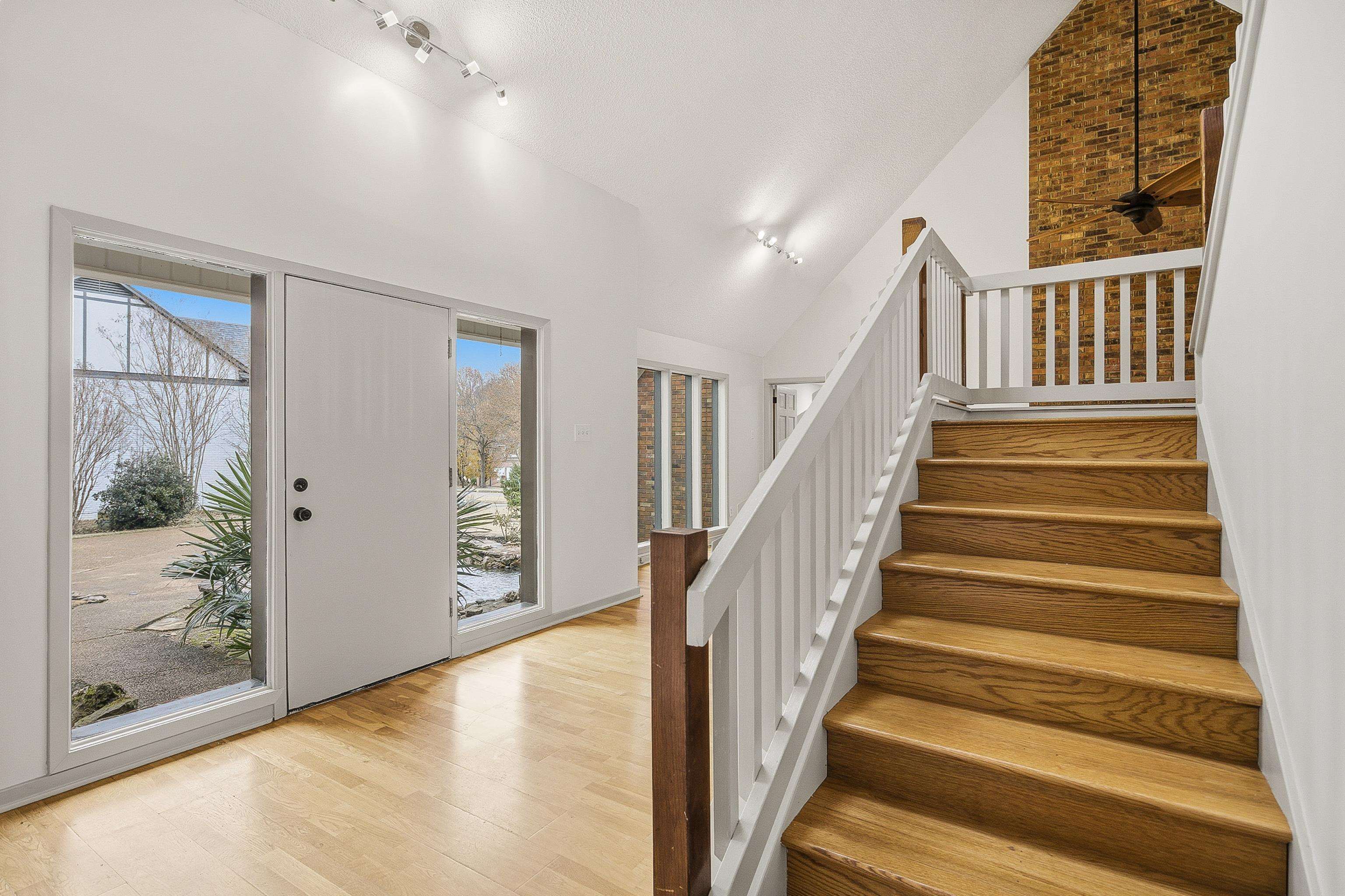 1833 New Riverdale Road Germantown, TN 38138 - Photo 5 of 40 a view of staircase with white walls and windows