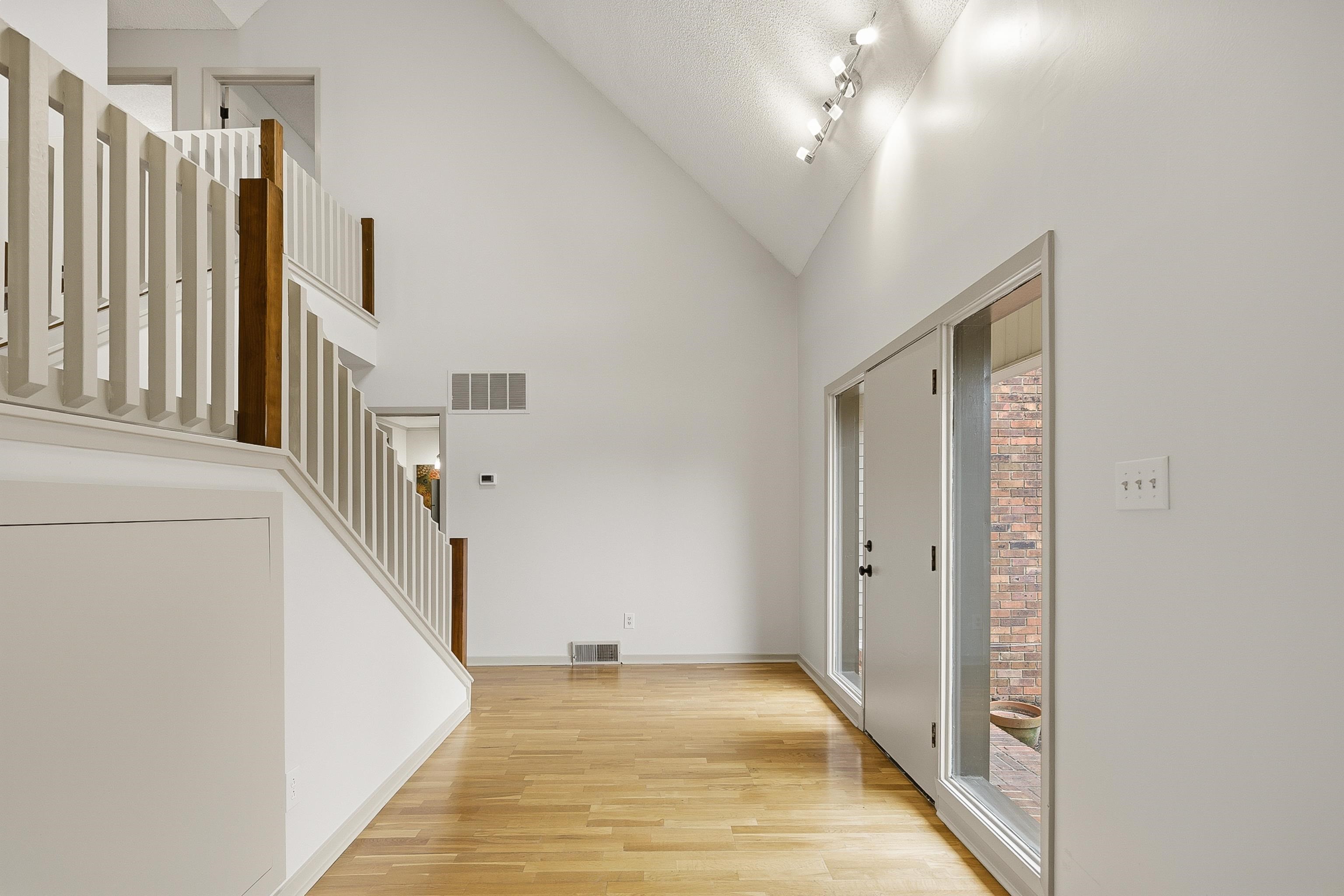 1833 New Riverdale Road Germantown, TN 38138 - Photo 7 of 40 a view of a hallway with entryway and stairs