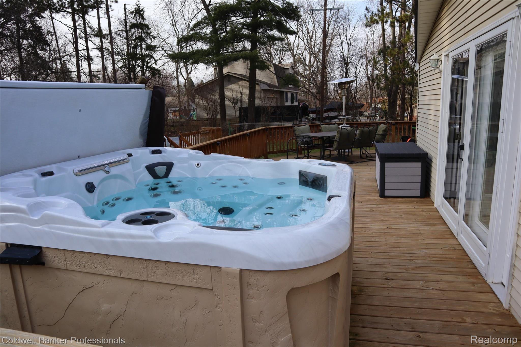 8075 South Eston Road Clarkston, MI 48348 - Photo 35 of 47 Hot tub on the wrap around deck.
