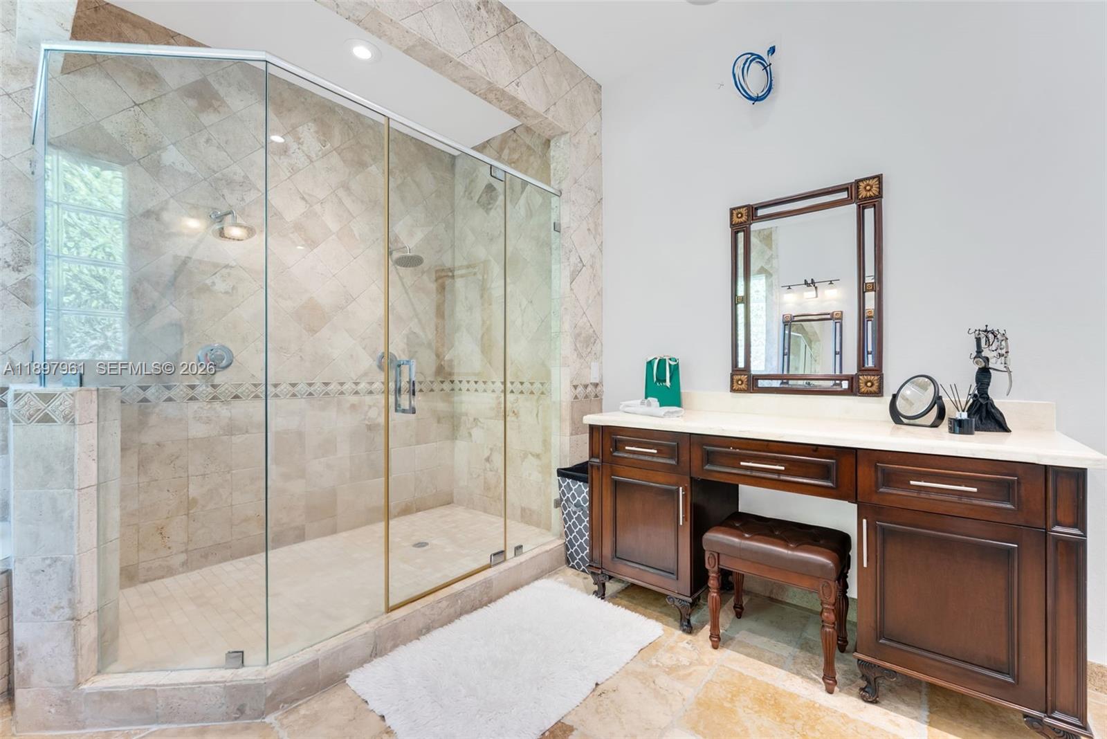 21331 Southwest 246th Street Homestead, FL 33031 - Photo 13 of 34 a spacious bathroom with a shower sink and mirror