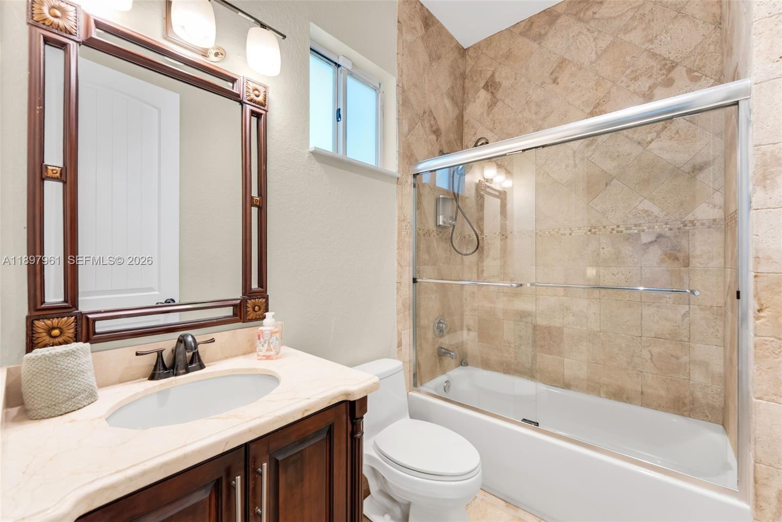 21331 Southwest 246th Street Homestead, FL 33031 - Photo 16 of 34 a bathroom with a sink and a mirror