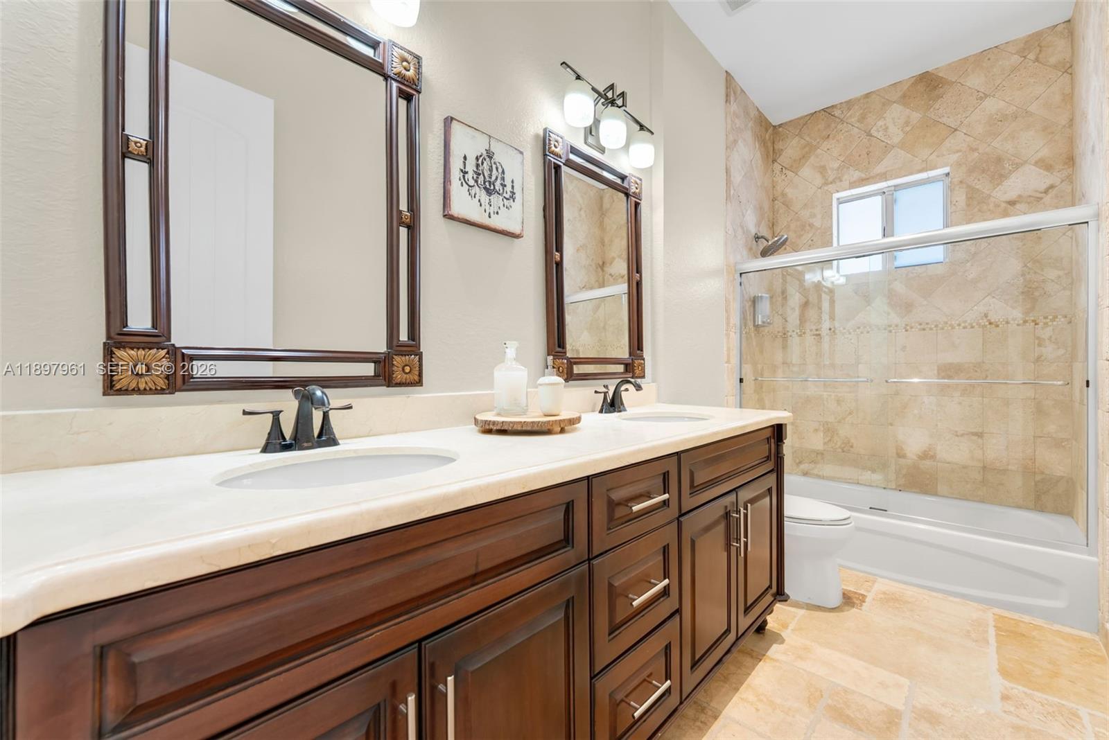 21331 Southwest 246th Street Homestead, FL 33031 - Photo 18 of 34 a bathroom with a sink double vanity and a bathtub