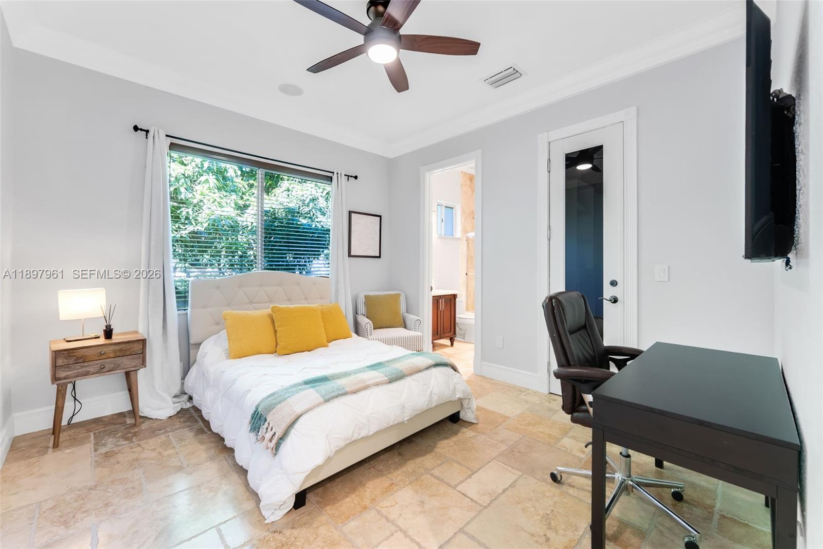 21331 Southwest 246th Street Homestead, FL 33031 - Photo 19 of 34 a bedroom with a bed and a desk