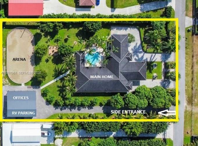 21331 Southwest 246th Street Homestead, FL 33031 - Photo 2 of 34 an aerial view of a house with swimming pool lawn chairs and yard