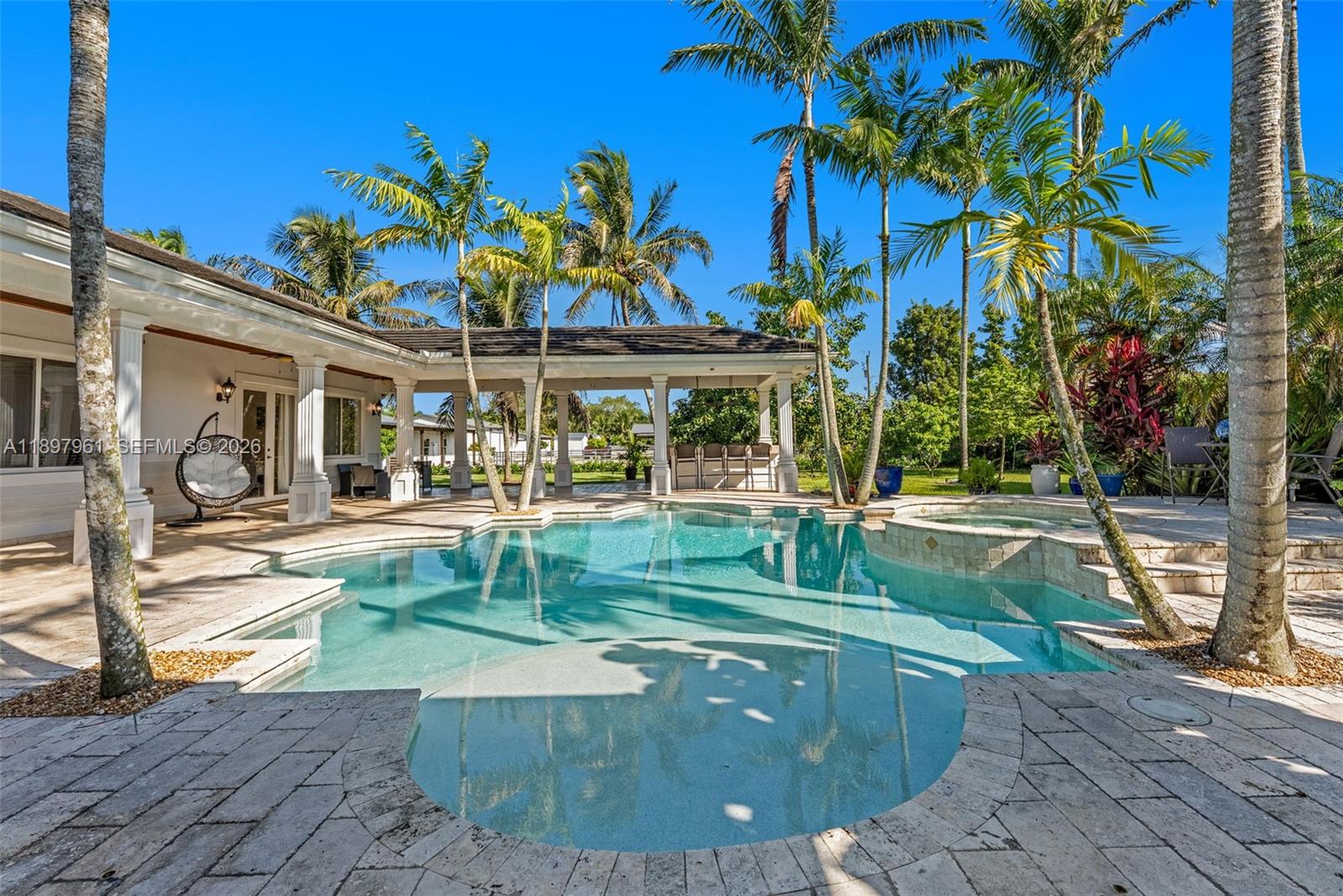 21331 Southwest 246th Street Homestead, FL 33031 - Photo 23 of 34 a view of a swimming pool with a patio