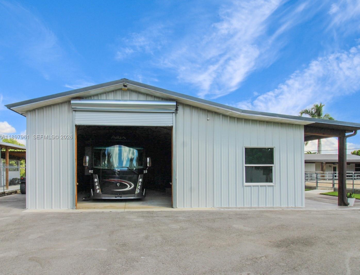 21331 Southwest 246th Street Homestead, FL 33031 - Photo 27 of 34 a front view of a house with a garage