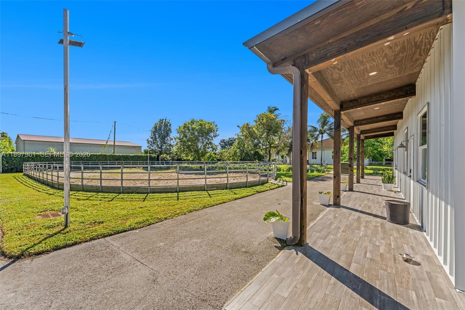 21331 Southwest 246th Street Homestead, FL 33031 - Photo 29 of 34 a view of a backyard with swimming pool