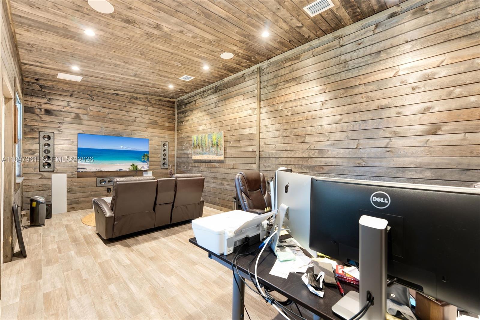 21331 Southwest 246th Street Homestead, FL 33031 - Photo 31 of 34 a living room with furniture and a flat screen tv