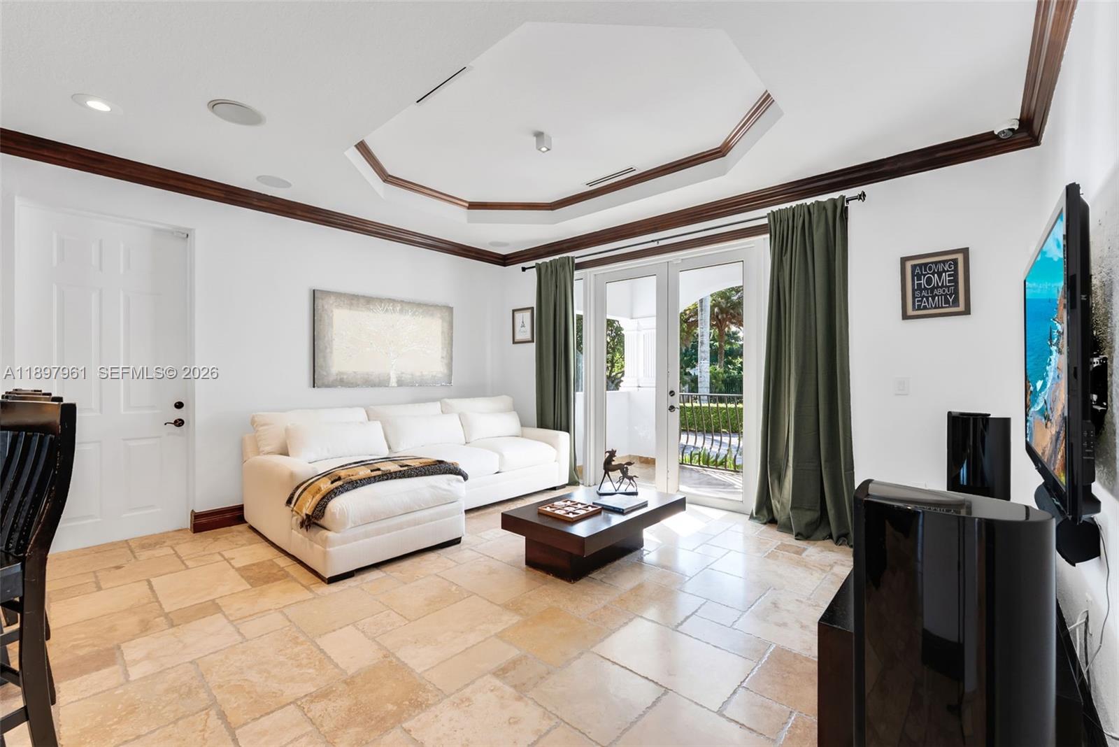 21331 Southwest 246th Street Homestead, FL 33031 - Photo 9 of 34 a spacious bedroom with a bed a couch and large window