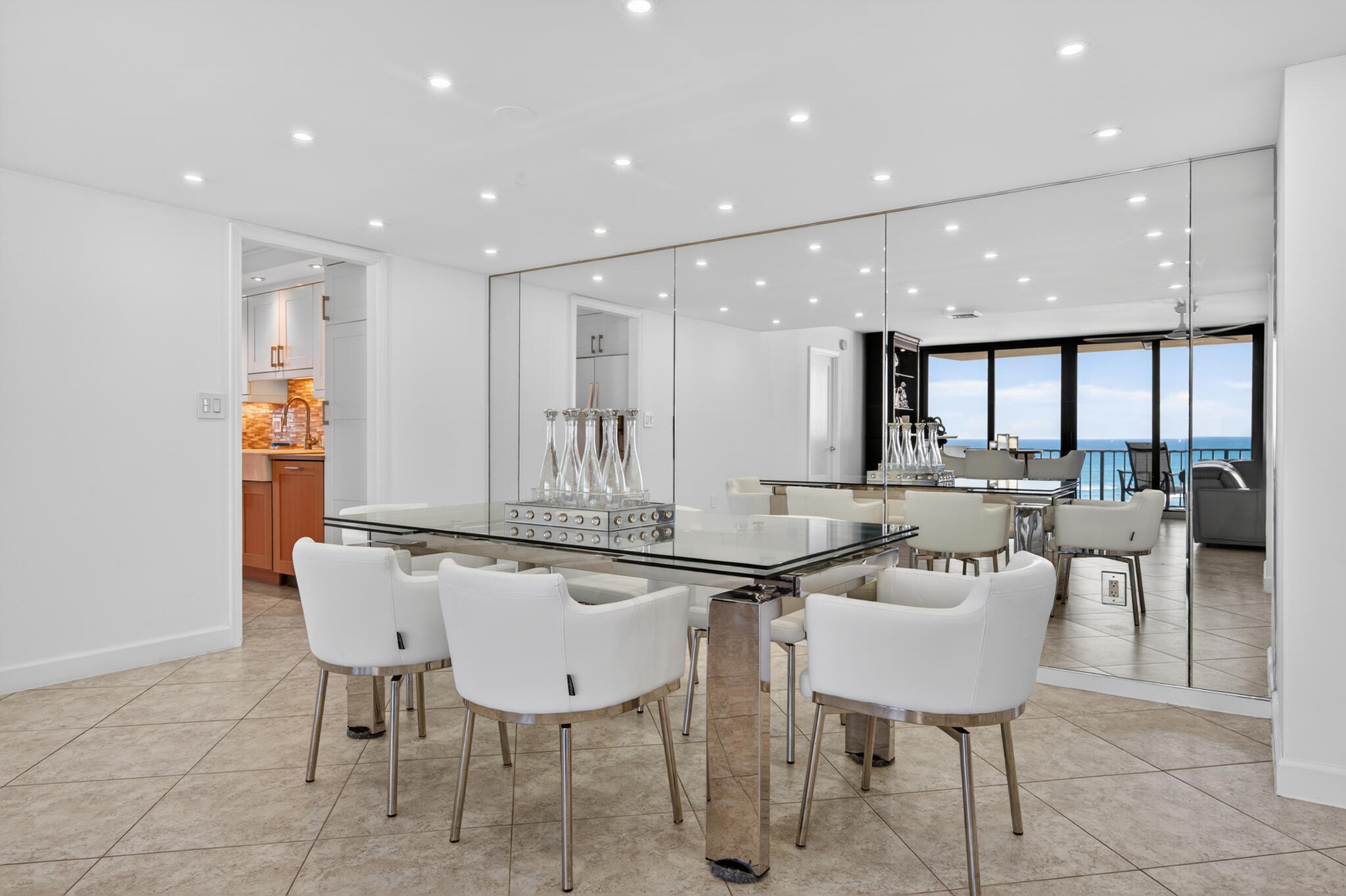 4200 North Ocean Avenue, Unit 11101 Riviera Beach, FL 33404 - Photo 13 of 35 a kitchen with a table and chairs