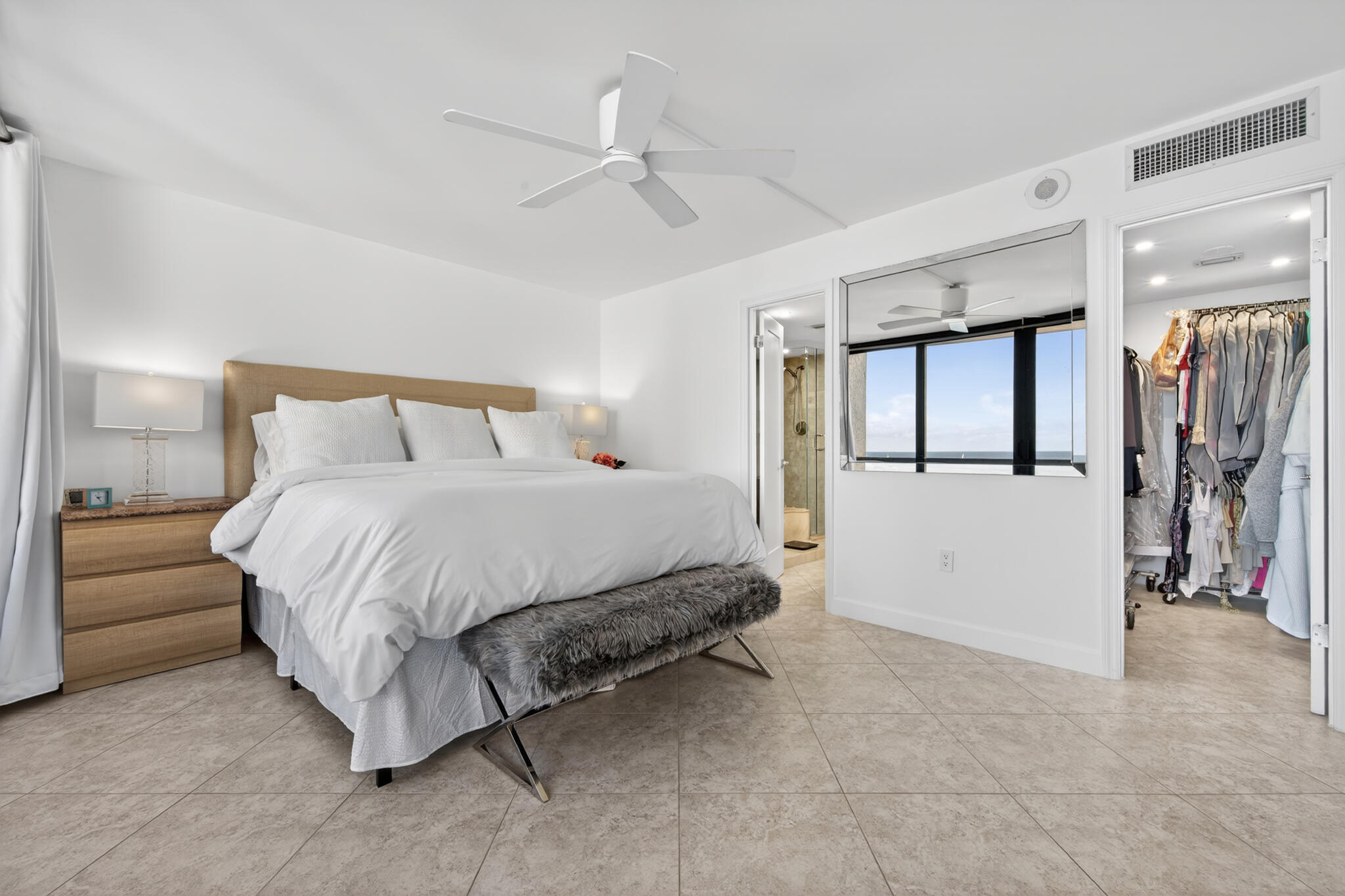 4200 North Ocean Avenue, Unit 11101 Riviera Beach, FL 33404 - Photo 20 of 35 a spacious bedroom with a bed and a cabinets