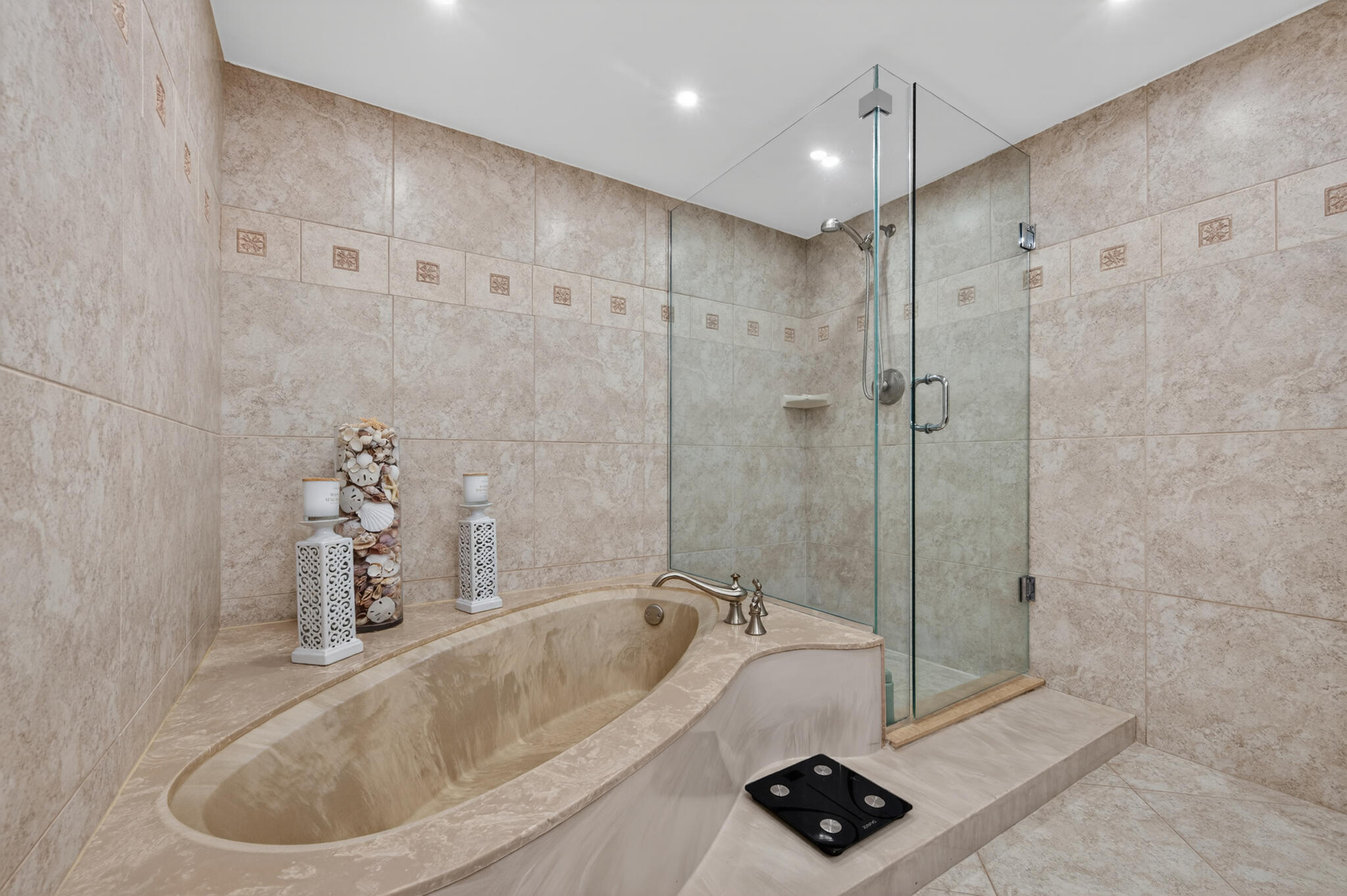 4200 North Ocean Avenue, Unit 11101 Riviera Beach, FL 33404 - Photo 23 of 35 a bathroom with a tub a sink and shower