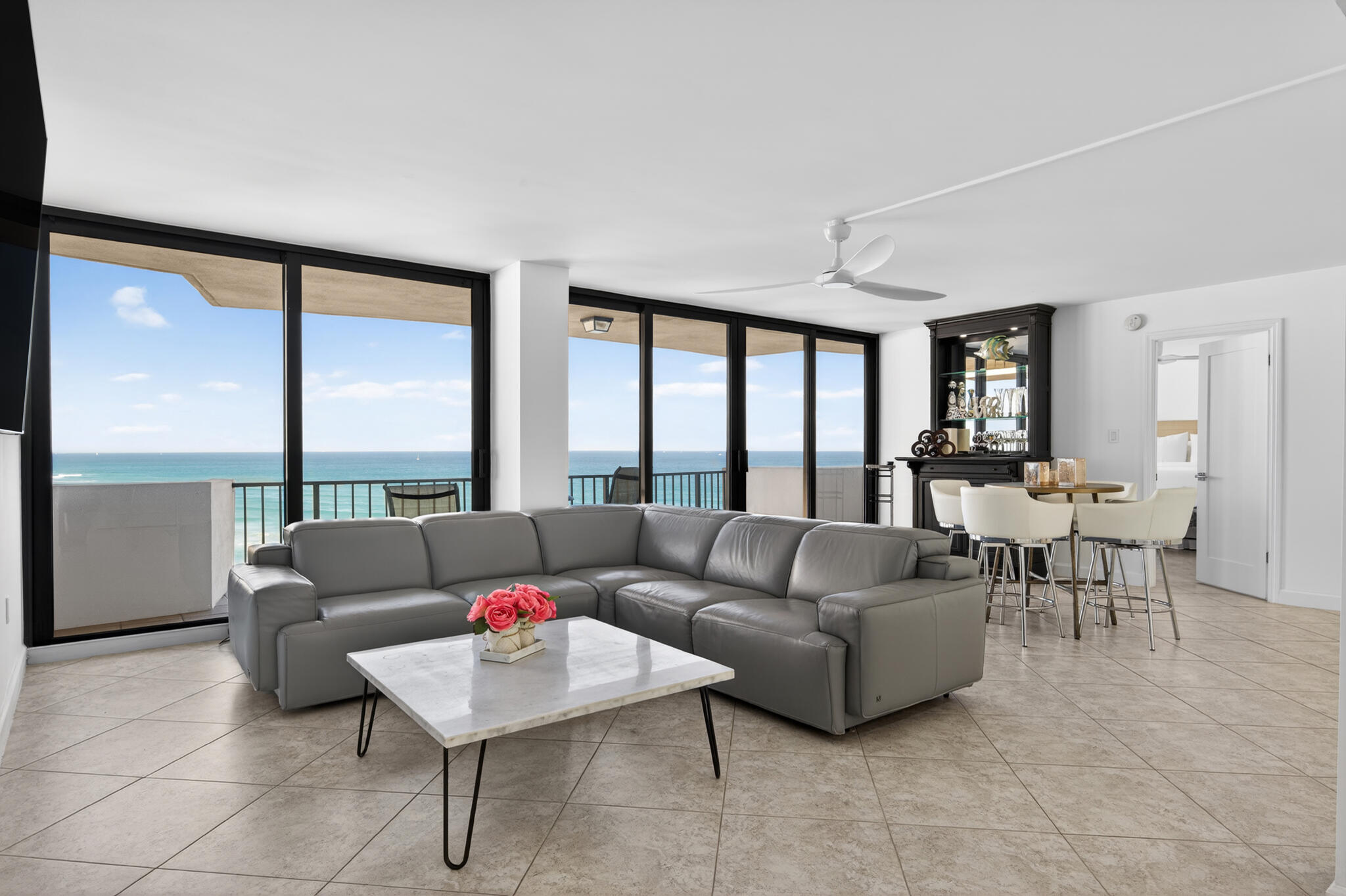 4200 North Ocean Avenue, Unit 11101 Riviera Beach, FL 33404 - Photo 3 of 35 a living room with furniture and a large window