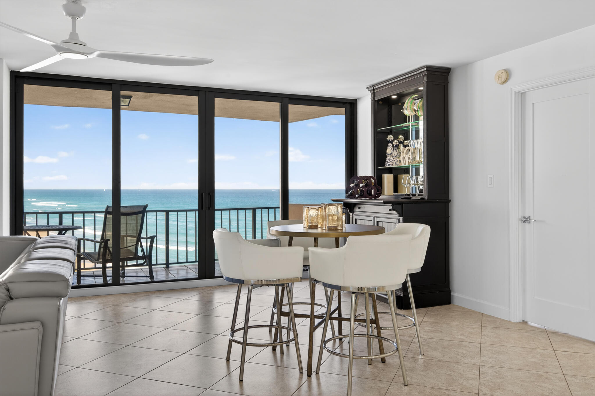 4200 North Ocean Avenue, Unit 11101 Riviera Beach, FL 33404 - Photo 4 of 35 a view of a dining room with furniture and floor to ceiling windows