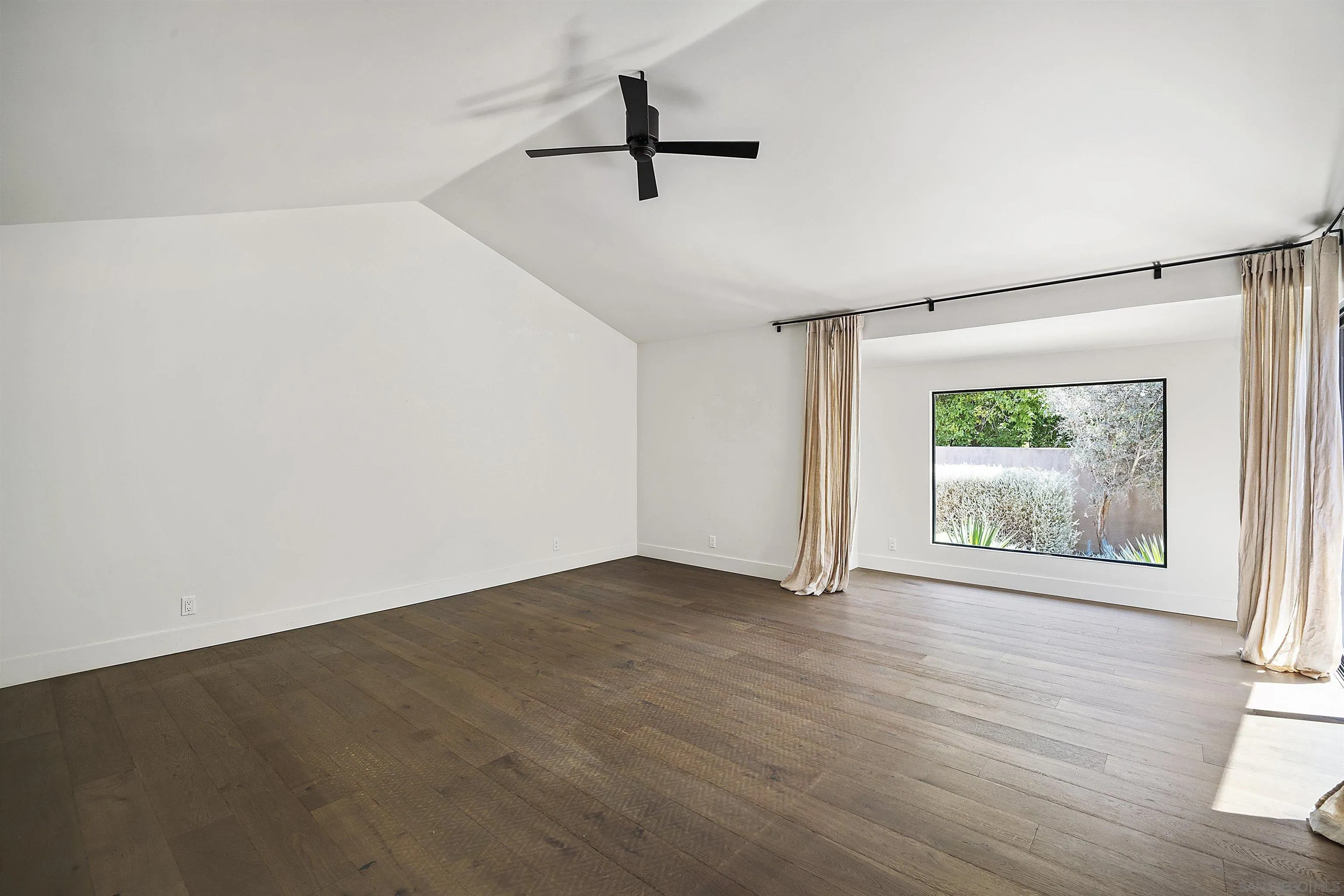 17335 Via Del Bravo Rancho Santa Fe, CA 92067 - Photo 20 of 47 wooden floor in an empty room with a window