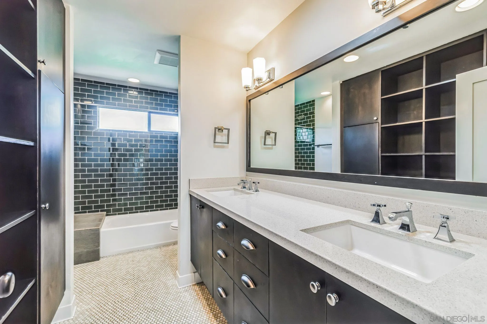 17335 Via Del Bravo Rancho Santa Fe, CA 92067 - Photo 28 of 47 a bathroom with a sink double vanity and a shower