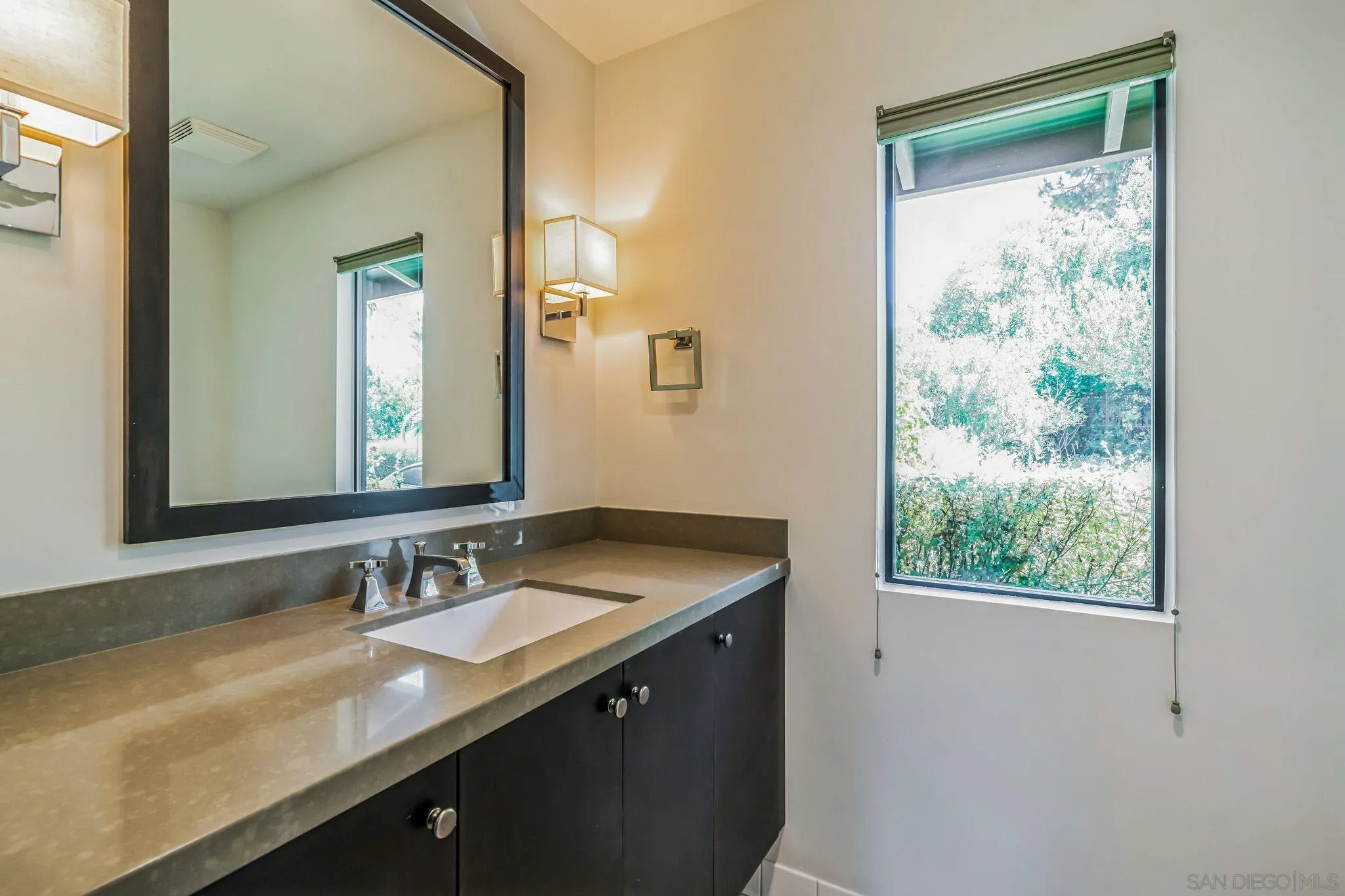 17335 Via Del Bravo Rancho Santa Fe, CA 92067 - Photo 45 of 47 a bathroom with a granite countertop sink and a mirror