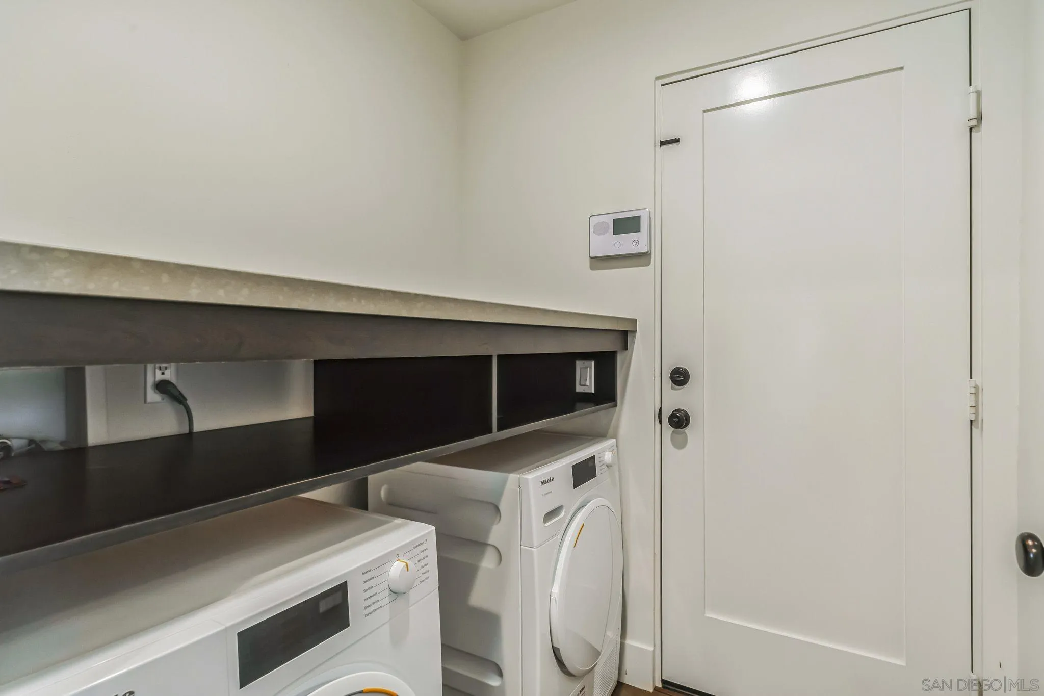 17335 Via Del Bravo Rancho Santa Fe, CA 92067 - Photo 46 of 47 a utility room with dryer and washer