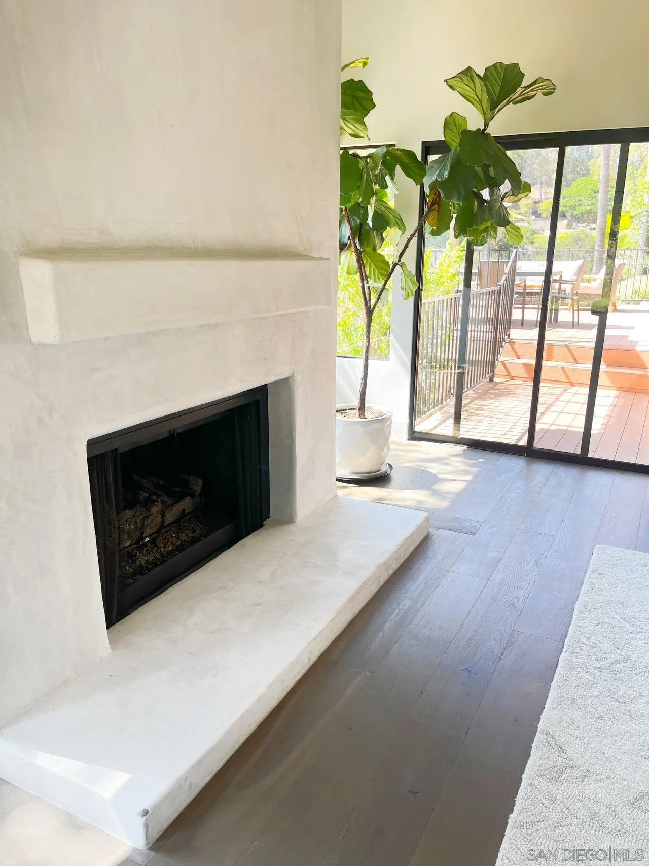 17335 Via Del Bravo Rancho Santa Fe, CA 92067 - Photo 9 of 47 a living room with furniture and a fireplace