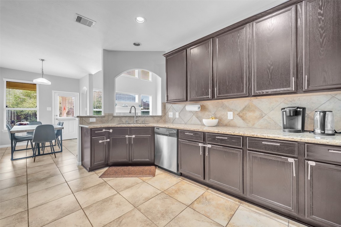 1230 Maple Ace Drive Katy, TX 77493 - Photo 12 of 40 a kitchen with a sink cabinets and window