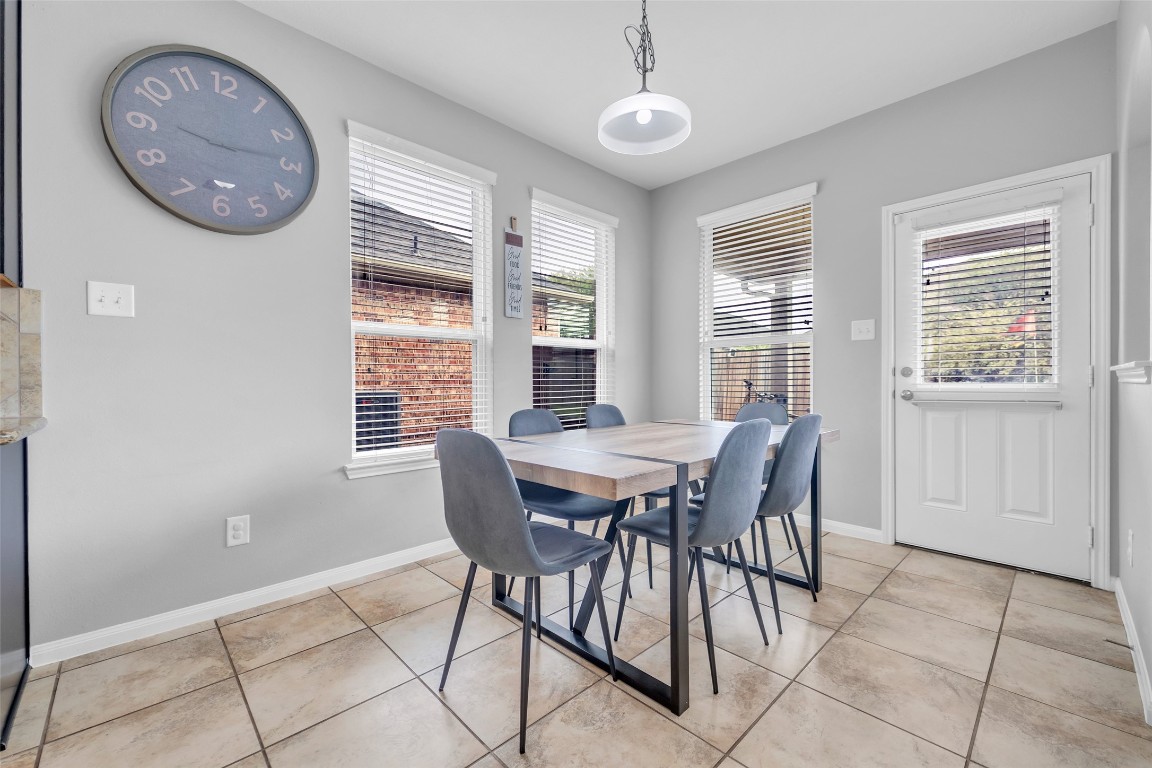 1230 Maple Ace Drive Katy, TX 77493 - Photo 15 of 40 a view of a dining room with furniture window and wooden floor