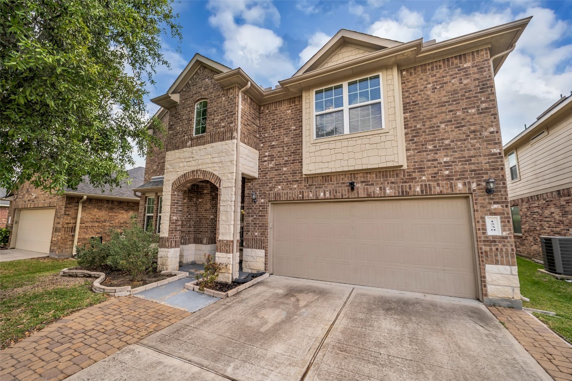 1230 Maple Ace Drive Katy, TX 77493 - Photo 2 of 40 a front view of a house with garden