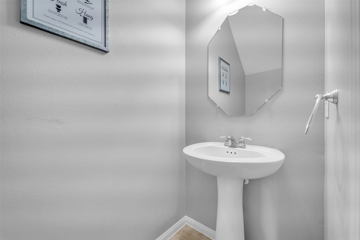 1230 Maple Ace Drive Katy, TX 77493 - Photo 22 of 40 a bathroom with a sink a mirror and shower