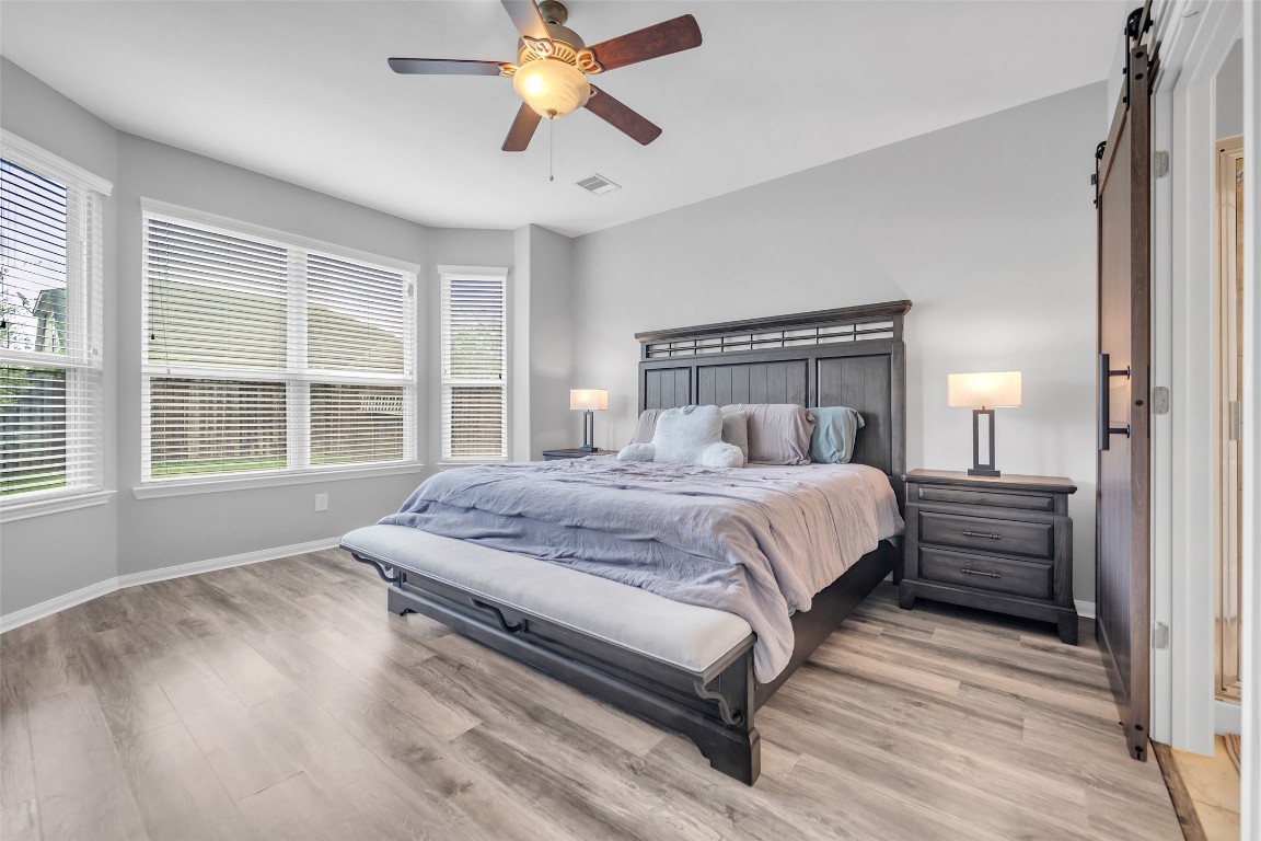1230 Maple Ace Drive Katy, TX 77493 - Photo 23 of 40 a bedroom with a bed and a window