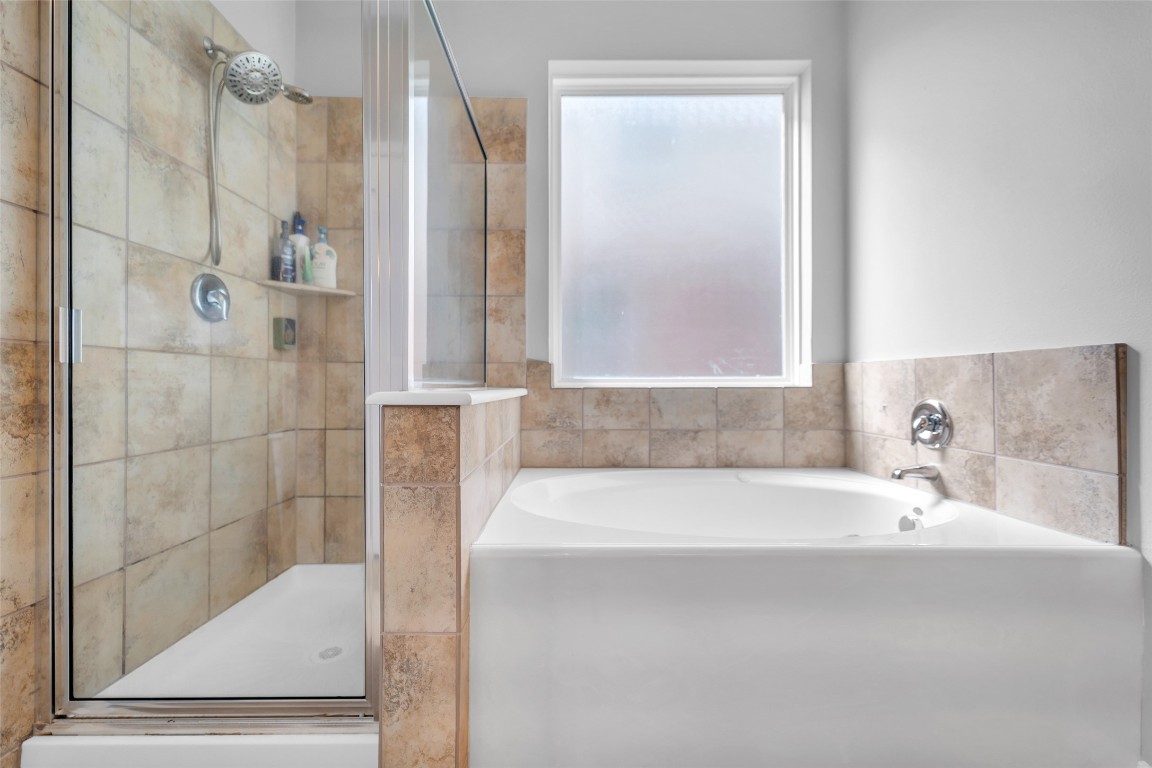 1230 Maple Ace Drive Katy, TX 77493 - Photo 26 of 40 a bathroom with a bathtub and a shower