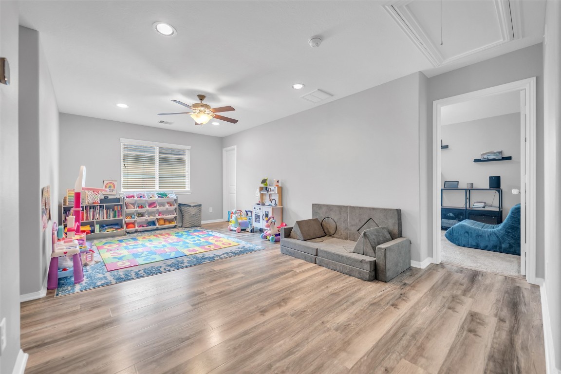 1230 Maple Ace Drive Katy, TX 77493 - Photo 27 of 40 a living room with furniture and a flat screen tv