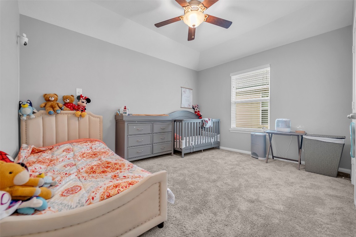 1230 Maple Ace Drive Katy, TX 77493 - Photo 31 of 40 a living room with a baby bed furniture and a window