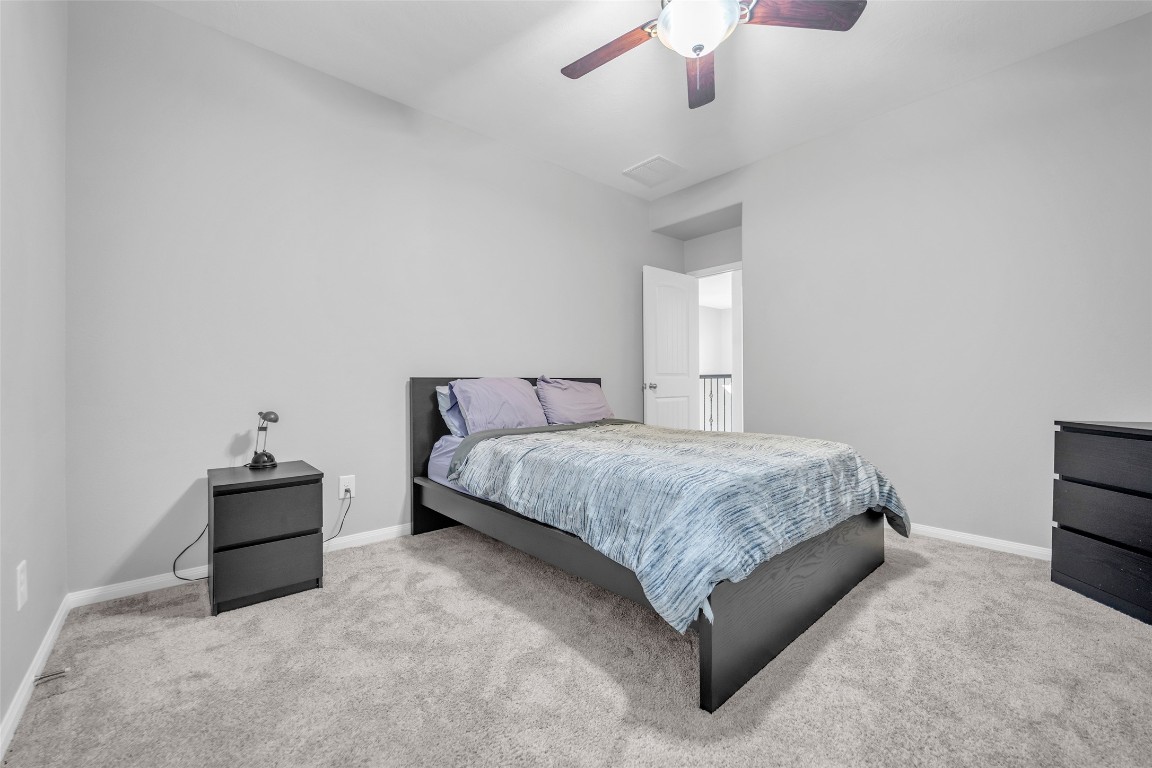 1230 Maple Ace Drive Katy, TX 77493 - Photo 32 of 40 a bedroom with a bed and window