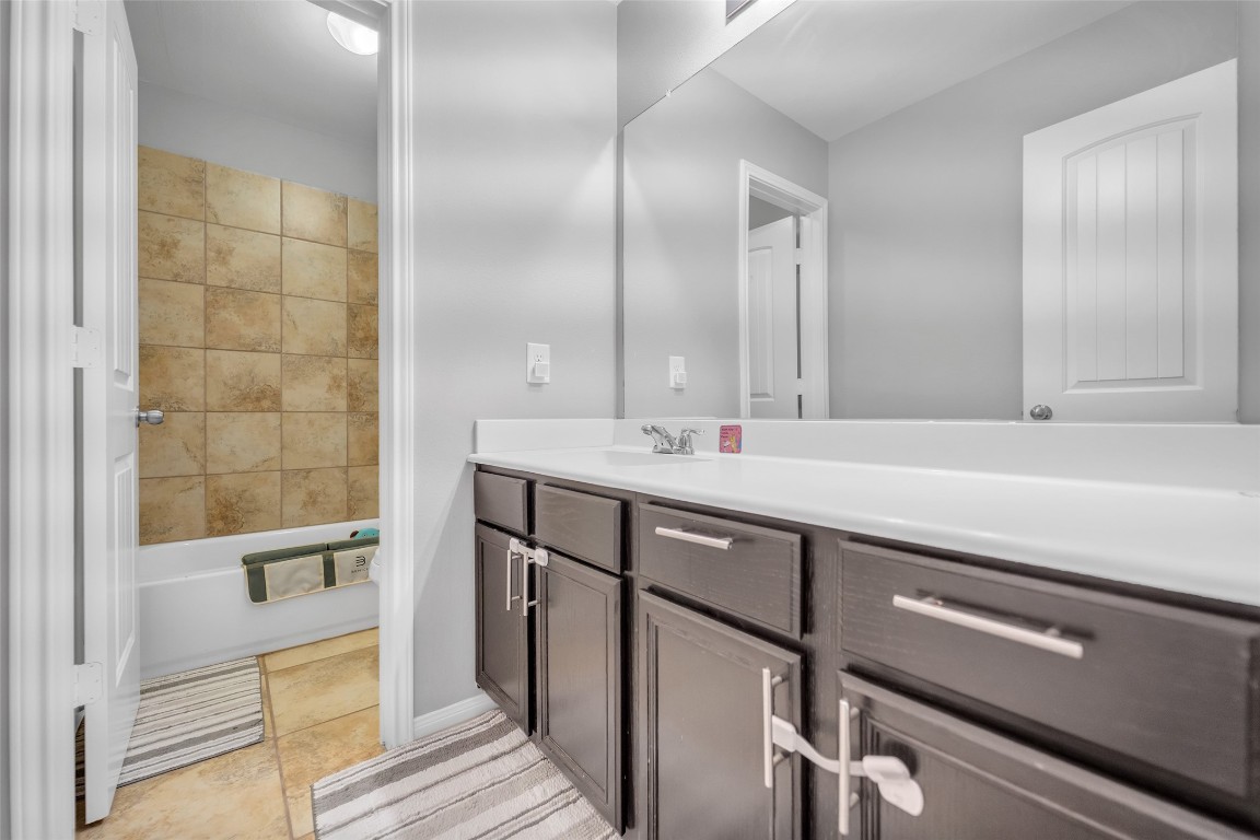 1230 Maple Ace Drive Katy, TX 77493 - Photo 34 of 40 a bathroom with a double vanity sink a mirror and a shower