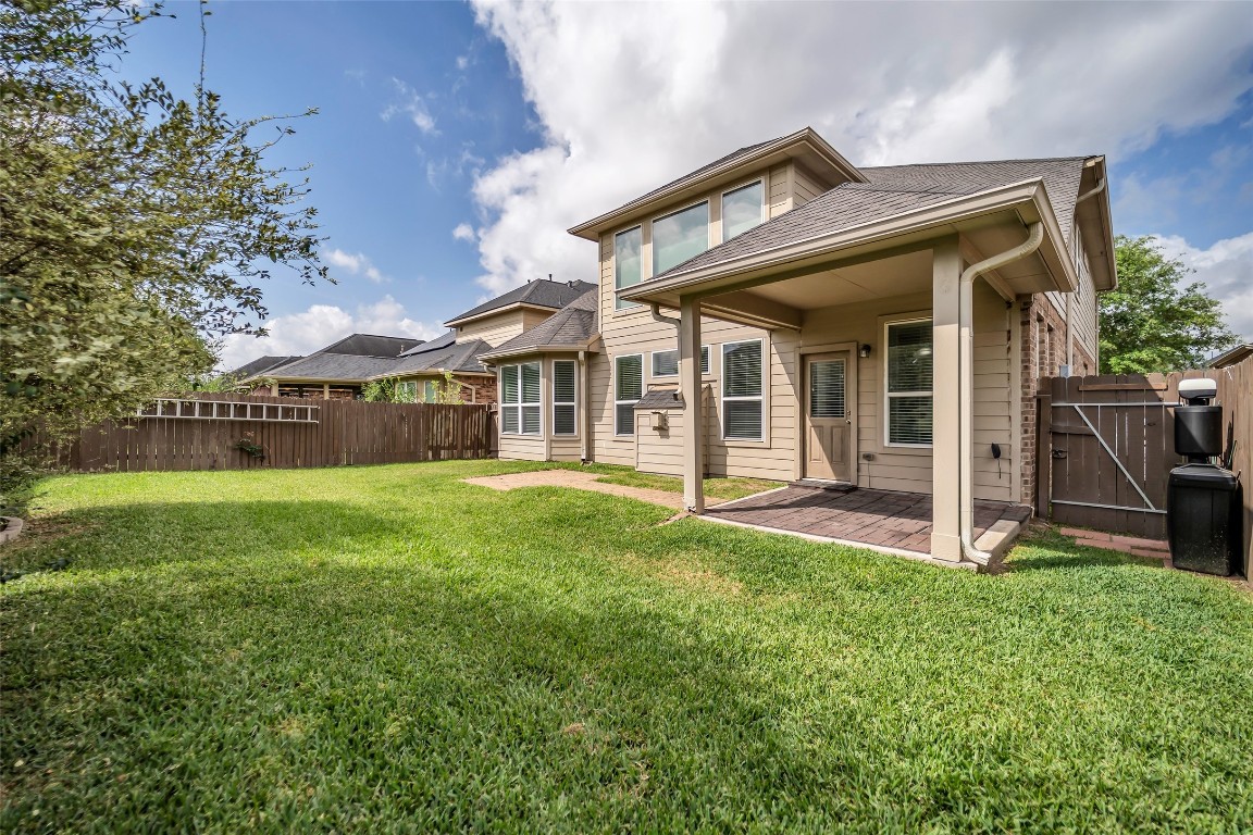 1230 Maple Ace Drive Katy, TX 77493 - Photo 36 of 40 a view of a house with a yard porch and sitting area