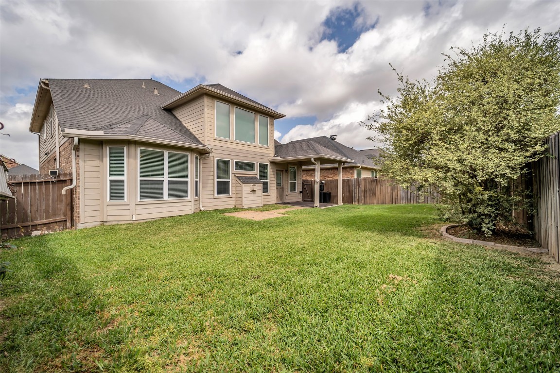 1230 Maple Ace Drive Katy, TX 77493 - Photo 40 of 40 a front view of a house with a garden