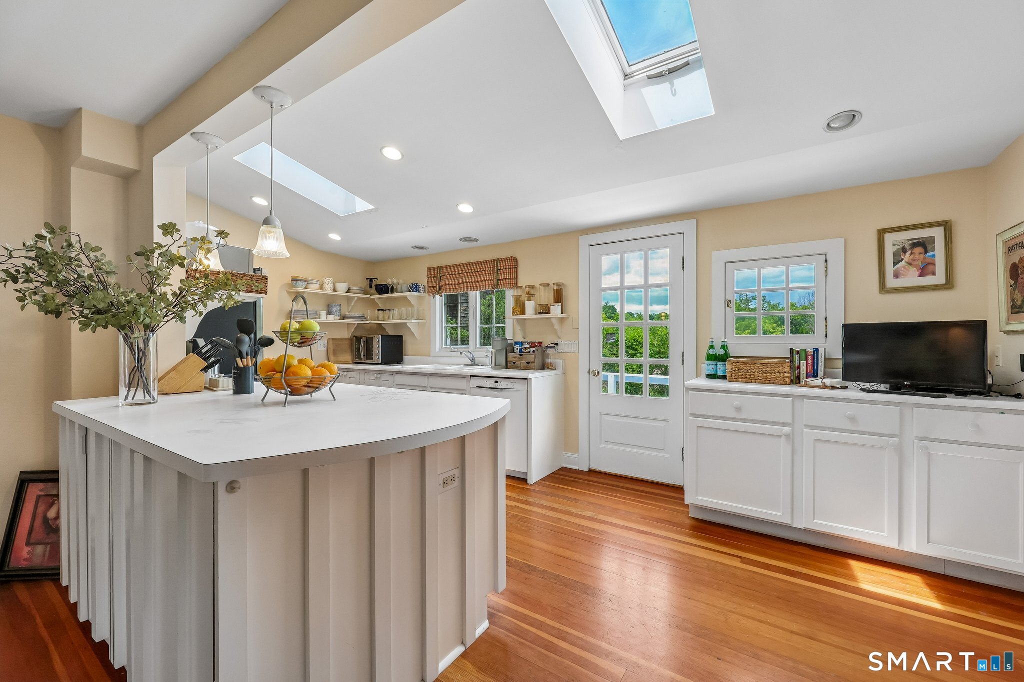 153 Middle Beach Road Madison, CT 06443 - Photo 9 of 40 The kitchen is cheery and open