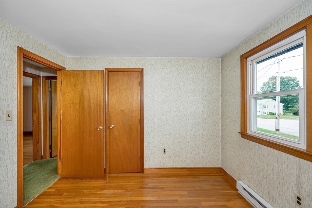 6 Thistle Road Burlington, MA 01803 - Photo 24 of 42 a view of an empty room with wooden floor and a window