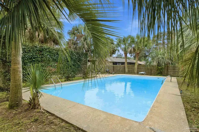 a view of a swimming pool with a patio