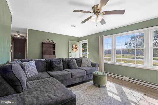 a living room with furniture and a window