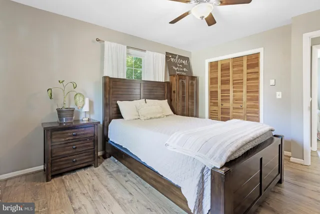 a bedroom with a bed and a dresser