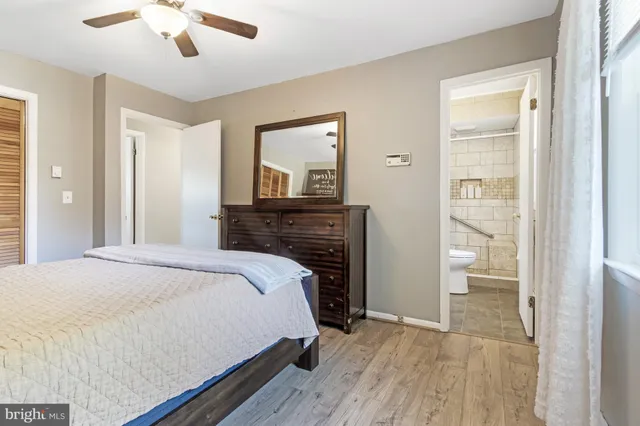 a bedroom with a bed and a fireplace