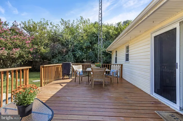 a view of a patio with wooden floor