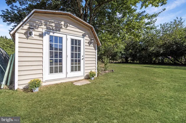 a view of backyard with a garden and entertaining space