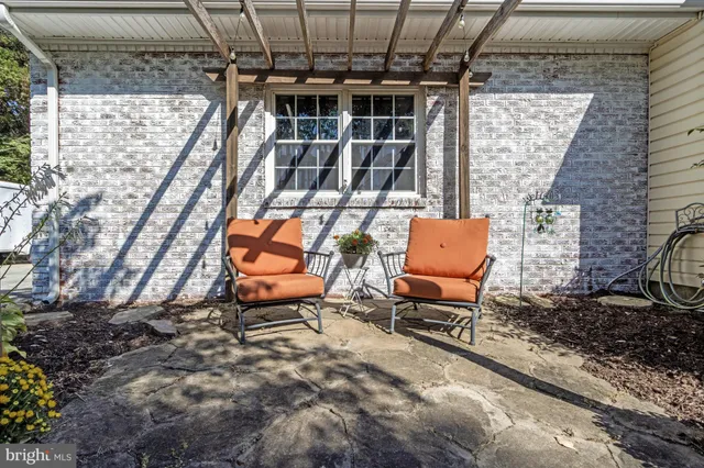 a backyard of a house with seating space