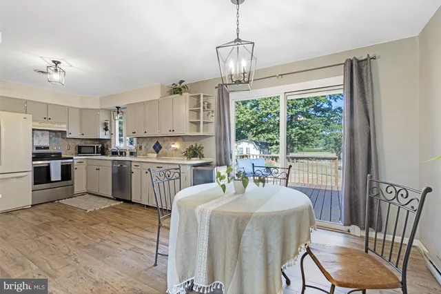 a kitchen with cabinets a counter space a sink appliances and a counter top space